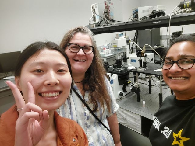 Working at the microscope in the Ou-Yang Lab at Lehigh