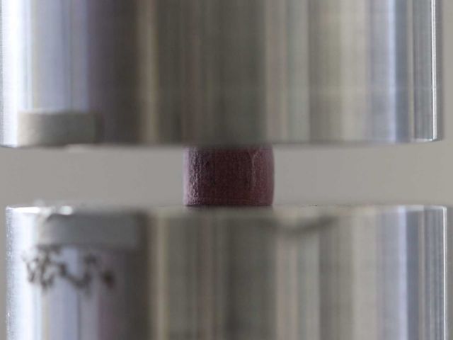 Compression of a porous material.